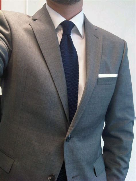 light grey suit navy shirt.